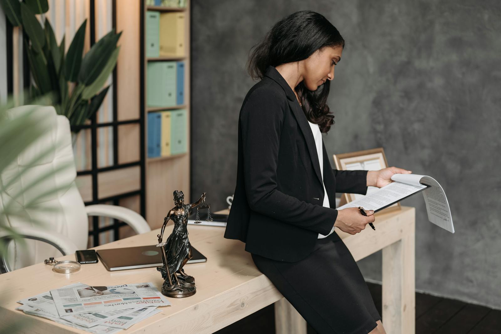 Professional reviewing documents at their desk