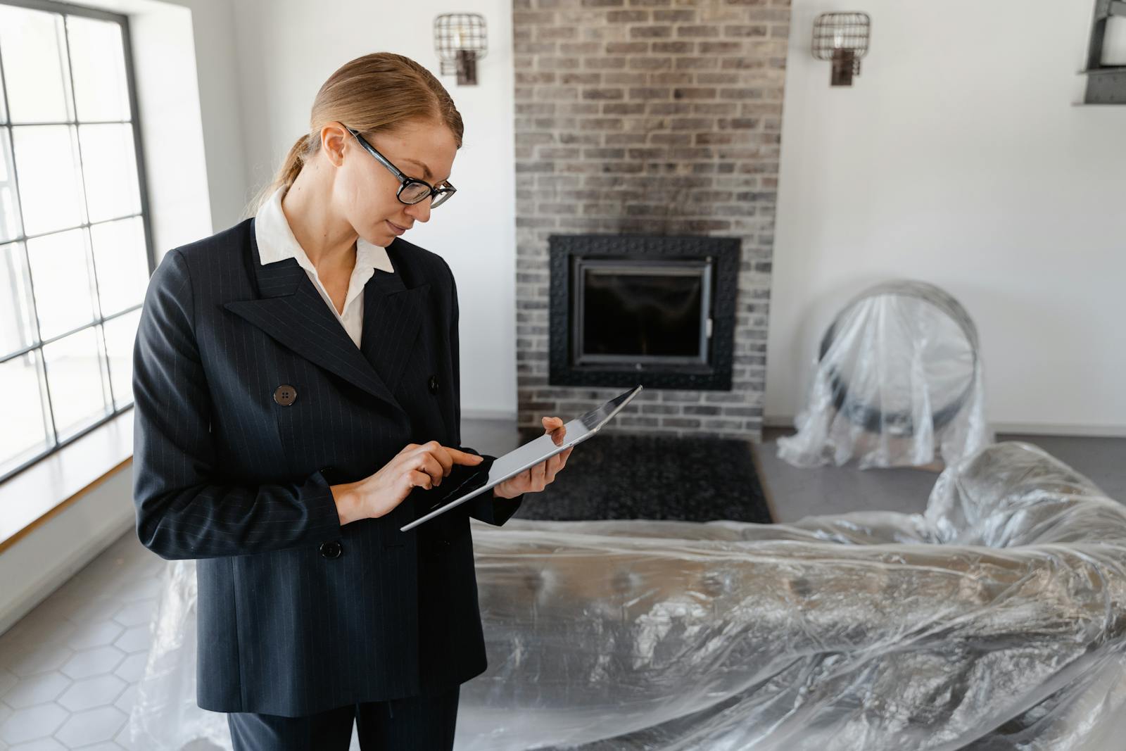 Real estate agent reviewing property details on a tablet