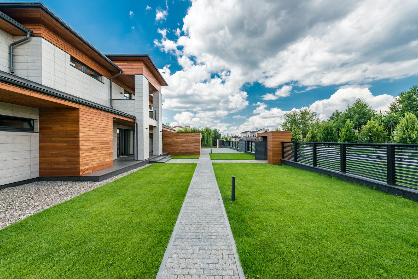 Contemporary house exterior with landscaped yard